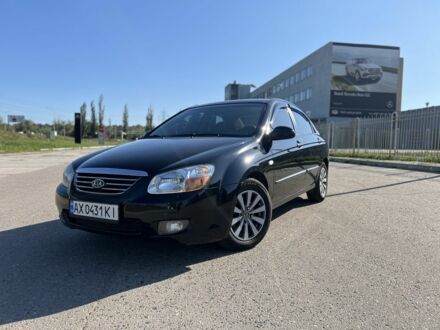Чорний Кіа Черато, об'ємом двигуна 2 л та пробігом 163 тис. км за 5500 $, фото 1 на Automoto.ua