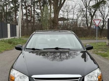 Черный Киа Черато, объемом двигателя 2 л и пробегом 186 тыс. км за 4999 $, фото 1 на Automoto.ua