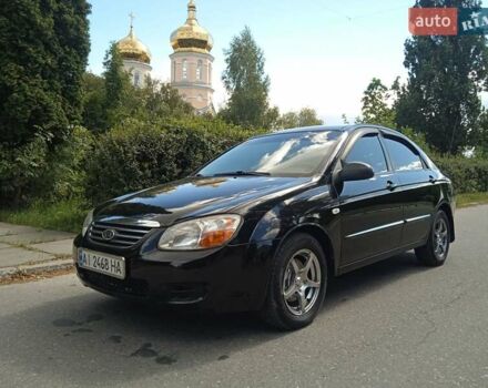 Черный Киа Черато, объемом двигателя 1.6 л и пробегом 200 тыс. км за 4500 $, фото 1 на Automoto.ua
