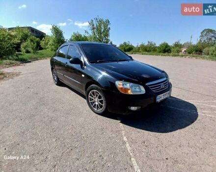 Черный Киа Черато, объемом двигателя 1.6 л и пробегом 225 тыс. км за 5200 $, фото 1 на Automoto.ua