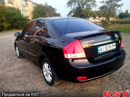 Черный Киа Черато, объемом двигателя 1.6 л и пробегом 272 тыс. км за 4700 $, фото 1 на Automoto.ua