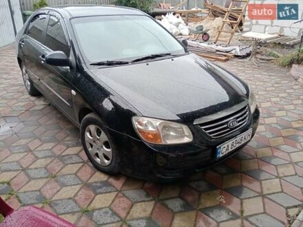 Черный Киа Черато, объемом двигателя 1.6 л и пробегом 260 тыс. км за 3800 $, фото 1 на Automoto.ua