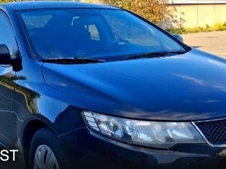 Черный Киа Черато, объемом двигателя 1.6 л и пробегом 300 тыс. км за 4999 $, фото 1 на Automoto.ua