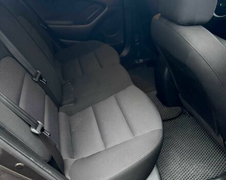 Коричневый Киа Черато, объемом двигателя 2 л и пробегом 107 тыс. км за 11000 $, фото 6 на Automoto.ua