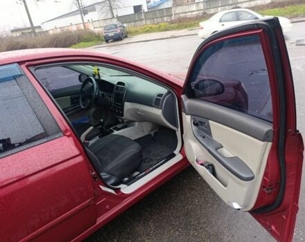 Красный Киа Черато, объемом двигателя 1.6 л и пробегом 230 тыс. км за 4400 $, фото 10 на Automoto.ua