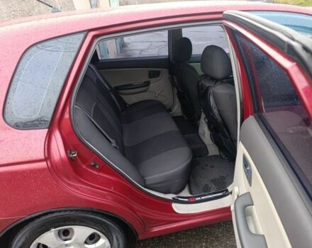 Красный Киа Черато, объемом двигателя 1.6 л и пробегом 230 тыс. км за 4400 $, фото 11 на Automoto.ua