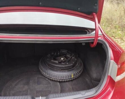 Червоний Кіа Черато, об'ємом двигуна 2 л та пробігом 345 тис. км за 6800 $, фото 7 на Automoto.ua