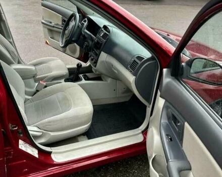 Красный Киа Черато, объемом двигателя 1.6 л и пробегом 229 тыс. км за 4500 $, фото 10 на Automoto.ua