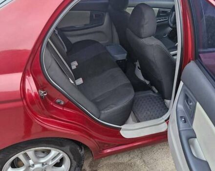 Красный Киа Черато, объемом двигателя 2 л и пробегом 233 тыс. км за 4700 $, фото 13 на Automoto.ua