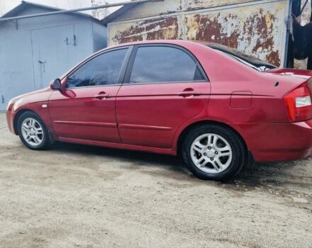 Красный Киа Черато, объемом двигателя 2 л и пробегом 233 тыс. км за 4700 $, фото 2 на Automoto.ua