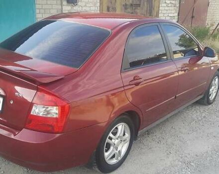 Червоний Кіа Черато, об'ємом двигуна 2 л та пробігом 143 тис. км за 5800 $, фото 3 на Automoto.ua