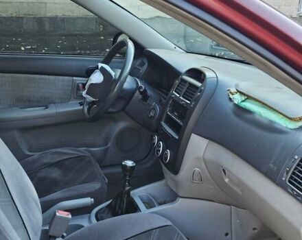 Красный Киа Черато, объемом двигателя 1.6 л и пробегом 200 тыс. км за 2600 $, фото 14 на Automoto.ua