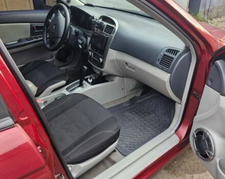 Красный Киа Черато, объемом двигателя 2 л и пробегом 233 тыс. км за 4700 $, фото 7 на Automoto.ua