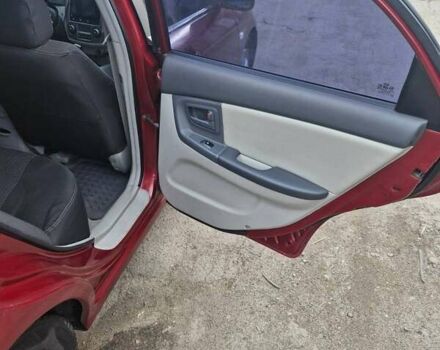 Красный Киа Черато, объемом двигателя 2 л и пробегом 233 тыс. км за 4700 $, фото 26 на Automoto.ua