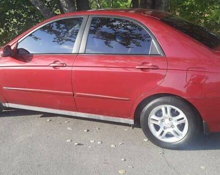 Красный Киа Черато, объемом двигателя 2 л и пробегом 144 тыс. км за 5400 $, фото 1 на Automoto.ua