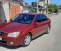Червоний Кіа Черато, об'ємом двигуна 2 л та пробігом 143 тис. км за 5800 $, фото 1 на Automoto.ua