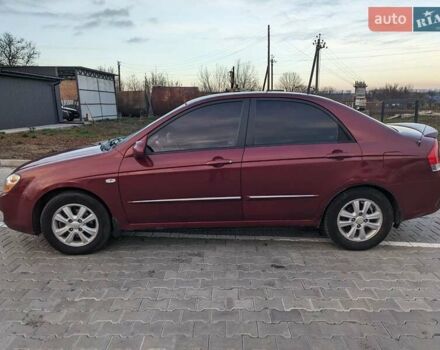 Красный Киа Черато, объемом двигателя 1.59 л и пробегом 240 тыс. км за 3750 $, фото 1 на Automoto.ua