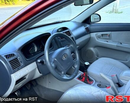 Красный Киа Черато, объемом двигателя 1.6 л и пробегом 250 тыс. км за 3500 $, фото 1 на Automoto.ua