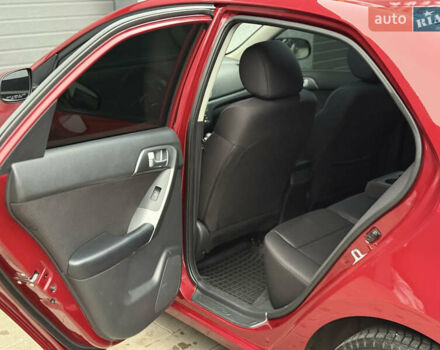 Красный Киа Черато, объемом двигателя 1.6 л и пробегом 200 тыс. км за 8900 $, фото 10 на Automoto.ua