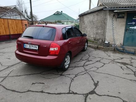 Красный Киа Черато, объемом двигателя 1.6 л и пробегом 230 тыс. км за 4400 $, фото 1 на Automoto.ua