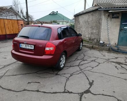 Красный Киа Черато, объемом двигателя 1.6 л и пробегом 230 тыс. км за 4400 $, фото 1 на Automoto.ua