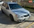 Серый Киа Черато, объемом двигателя 2 л и пробегом 326 тыс. км за 4500 $, фото 1 на Automoto.ua