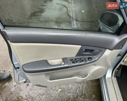 Сірий Кіа Черато, об'ємом двигуна 2 л та пробігом 280 тис. км за 2100 $, фото 13 на Automoto.ua