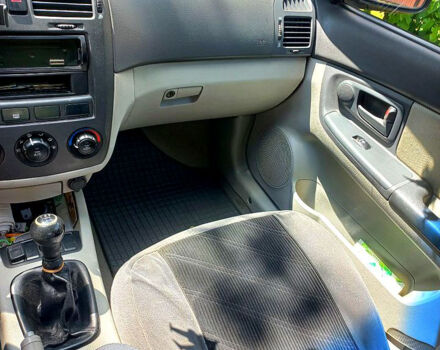 Серый Киа Черато, объемом двигателя 1.6 л и пробегом 300 тыс. км за 3900 $, фото 3 на Automoto.ua