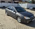 Сірий Кіа Черато, об'ємом двигуна 1.6 л та пробігом 307 тис. км за 4600 $, фото 1 на Automoto.ua
