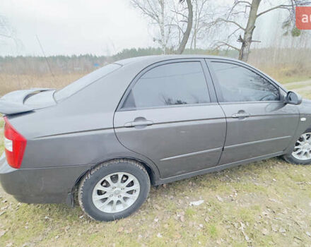 Серый Киа Черато, объемом двигателя 2 л и пробегом 180 тыс. км за 3800 $, фото 5 на Automoto.ua