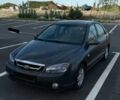 Сірий Кіа Черато, об'ємом двигуна 2 л та пробігом 316 тис. км за 3750 $, фото 1 на Automoto.ua