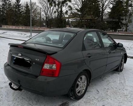 Серый Киа Черато, объемом двигателя 2 л и пробегом 316 тыс. км за 4200 $, фото 2 на Automoto.ua