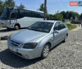 Серый Киа Черато, объемом двигателя 2 л и пробегом 250 тыс. км за 2850 $, фото 1 на Automoto.ua