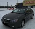 Серый Киа Черато, объемом двигателя 2 л и пробегом 316 тыс. км за 3900 $, фото 1 на Automoto.ua