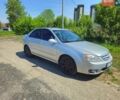Серый Киа Черато, объемом двигателя 2 л и пробегом 306 тыс. км за 4800 $, фото 1 на Automoto.ua
