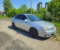 Серый Киа Черато, объемом двигателя 2 л и пробегом 306 тыс. км за 4800 $, фото 1 на Automoto.ua