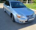 Сірий Кіа Черато, об'ємом двигуна 2 л та пробігом 418 тис. км за 3955 $, фото 1 на Automoto.ua