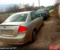 Серый Киа Черато, объемом двигателя 2 л и пробегом 230 тыс. км за 3400 $, фото 1 на Automoto.ua