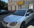 Серый Киа Черато, объемом двигателя 1.6 л и пробегом 350 тыс. км за 3200 $, фото 2 на Automoto.ua