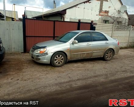 Серый Киа Черато, объемом двигателя 2 л и пробегом 230 тыс. км за 3400 $, фото 3 на Automoto.ua