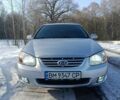 Серый Киа Черато, объемом двигателя 2 л и пробегом 240 тыс. км за 5600 $, фото 1 на Automoto.ua