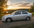Сірий Кіа Черато, об'ємом двигуна 2 л та пробігом 350 тис. км за 3413 $, фото 1 на Automoto.ua