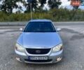 Серый Киа Черато, объемом двигателя 2 л и пробегом 275 тыс. км за 4000 $, фото 1 на Automoto.ua