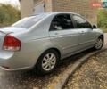Сірий Кіа Черато, об'ємом двигуна 2 л та пробігом 199 тис. км за 5099 $, фото 2 на Automoto.ua