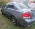 Серый Киа Черато, объемом двигателя 1.98 л и пробегом 230 тыс. км за 3000 $, фото 3 на Automoto.ua