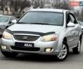 Серый Киа Черато, объемом двигателя 1.98 л и пробегом 195 тыс. км за 6300 $, фото 1 на Automoto.ua