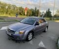 Серый Киа Черато, объемом двигателя 2 л и пробегом 200 тыс. км за 3000 $, фото 1 на Automoto.ua