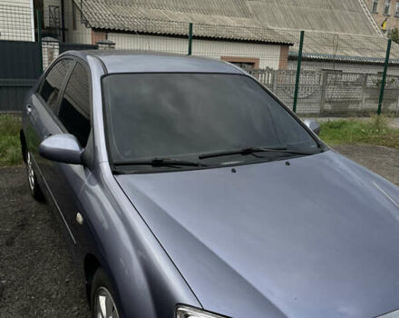 Серый Киа Черато, объемом двигателя 2 л и пробегом 245 тыс. км за 3900 $, фото 6 на Automoto.ua