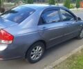 Серый Киа Черато, объемом двигателя 1.6 л и пробегом 180 тыс. км за 5900 $, фото 2 на Automoto.ua