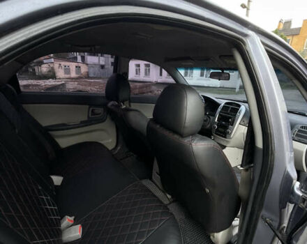 Серый Киа Черато, объемом двигателя 2 л и пробегом 245 тыс. км за 3900 $, фото 5 на Automoto.ua